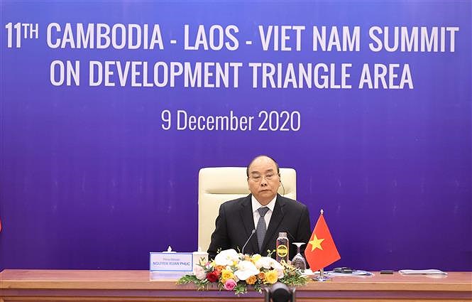 PM attends 11th Cambodia-Laos-Vietnam summit on development triangle area hinh anh 6