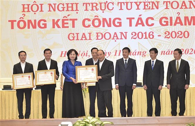 National conference honours outstanding representatives in poverty reduction hinh anh 1