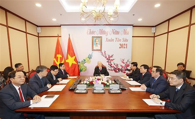 Top leader holds phone talks with new Secretary General of Lao People’s Revolutionary Party hinh anh 2
