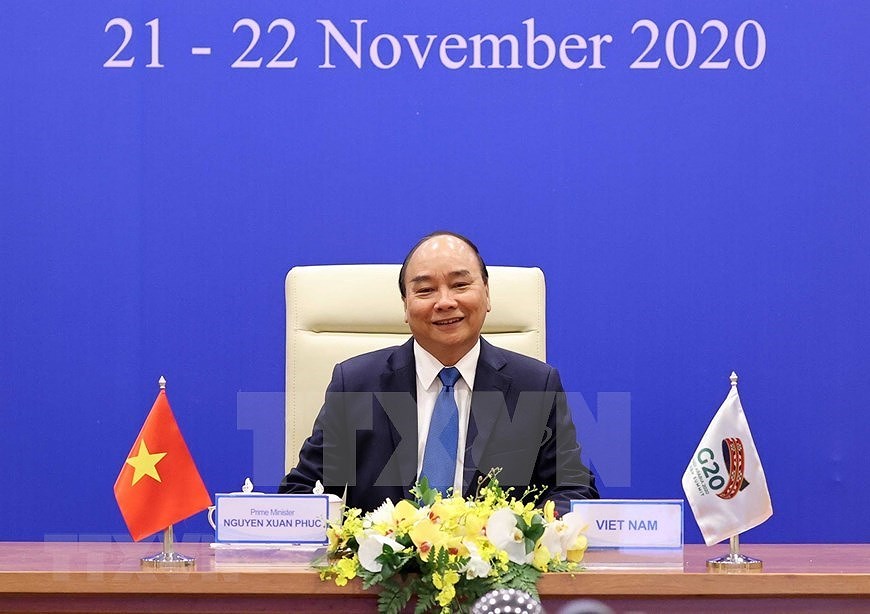Le Premier ministre Nguyen Xuan Phuc assiste au Sommet virtuel du G20 hinh anh 2