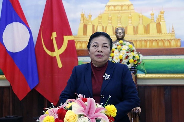 Официальныи представитель партии Лаоса подчеркнул ведущую роль КПВ в успехе Вьетнама hinh anh 1