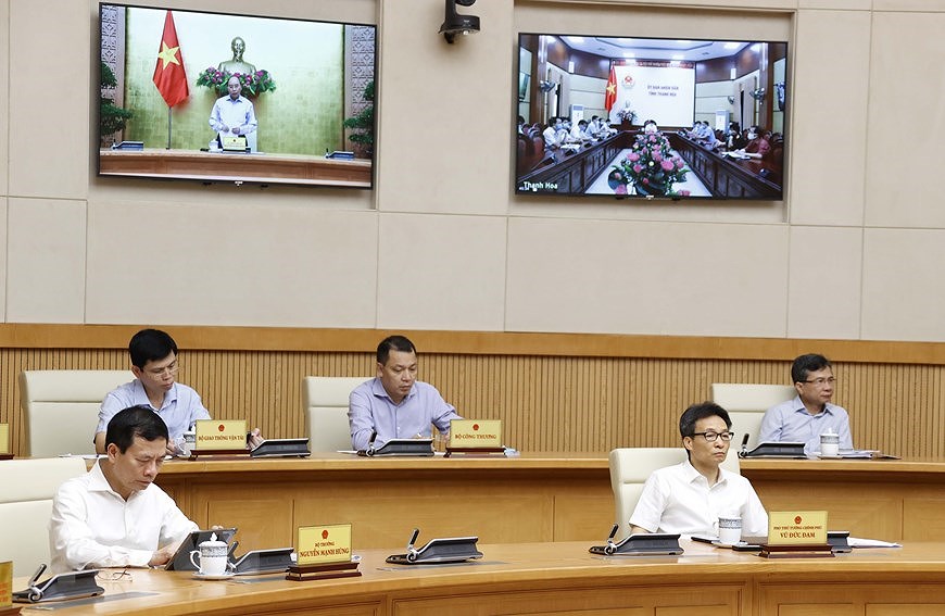 组图：政府总理举行全国抗击新冠肺炎疫情视频会议 hinh anh 5