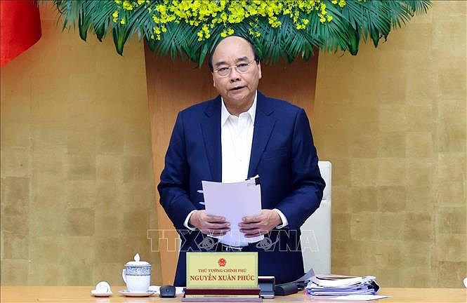 Prime Minister request reviewing COVID-19 prevention measures, scenarios hinh anh 1