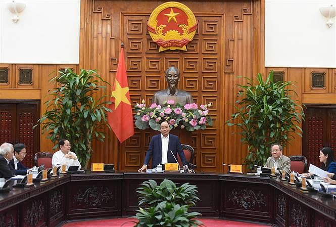 PM chairs meeting of compilation board for book on Government history hinh anh 1