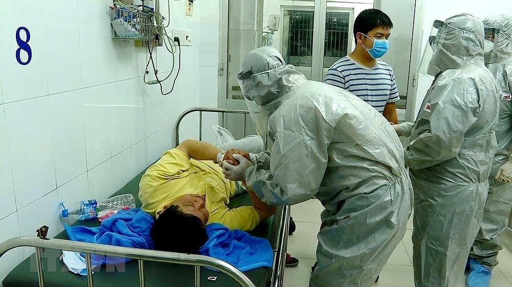 [Foto] Vietnam se esfuerza por controlar el contagio del coronavirus hinh anh 4