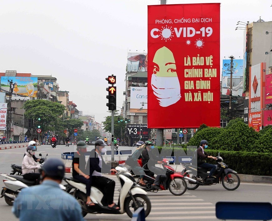 [Foto] Carteles sobre COVID-19 en Hanoi hinh anh 3