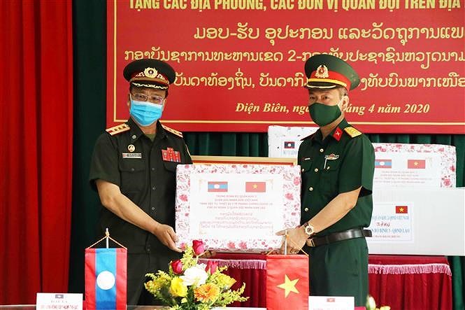 [Foto] Vietnam une manos con otros paises de ASEAN en lucha contra COVID-19 hinh anh 11