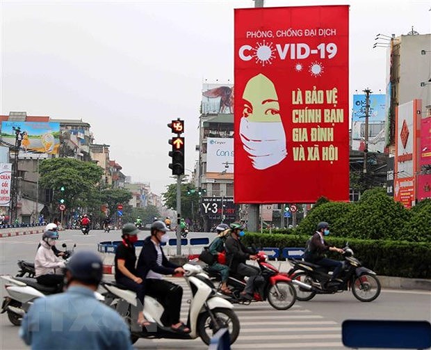 Partido Comunista y Estado de Vietnam con alta confianza del publico en lucha antiepidemica, dice sondeo global hinh anh 1