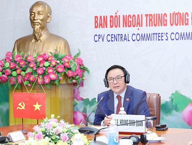 Partido Comunista de Vietnam y el Grupo Parlamentario Britanico sostienen el primer dialogo hinh anh 1