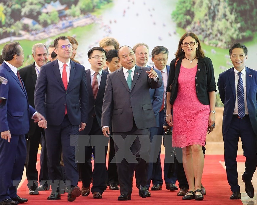 [Fotos] Firman Acuerdos de Libre Comercio y de Proteccion de la Inversion entre Vietnam y UE hinh anh 7