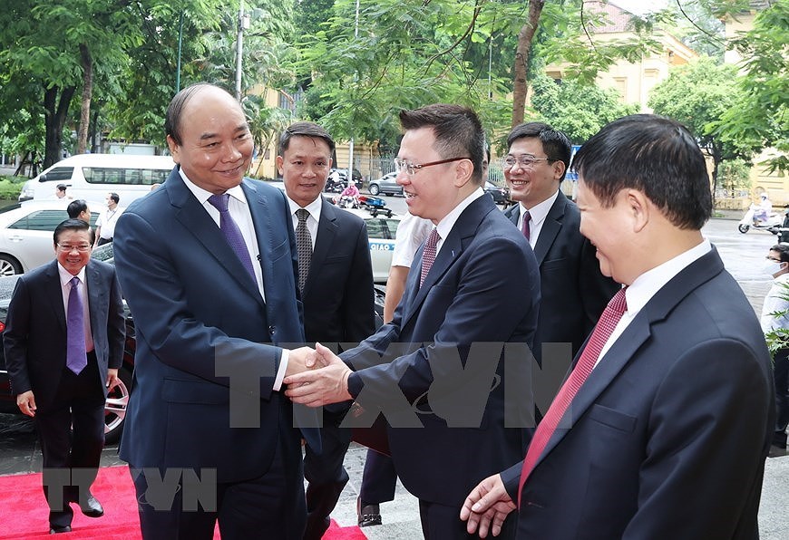 Primer ministro de Vietnam asiste al acto conmemorativo del aniversario 75 de la fundacion de la VNA hinh anh 2